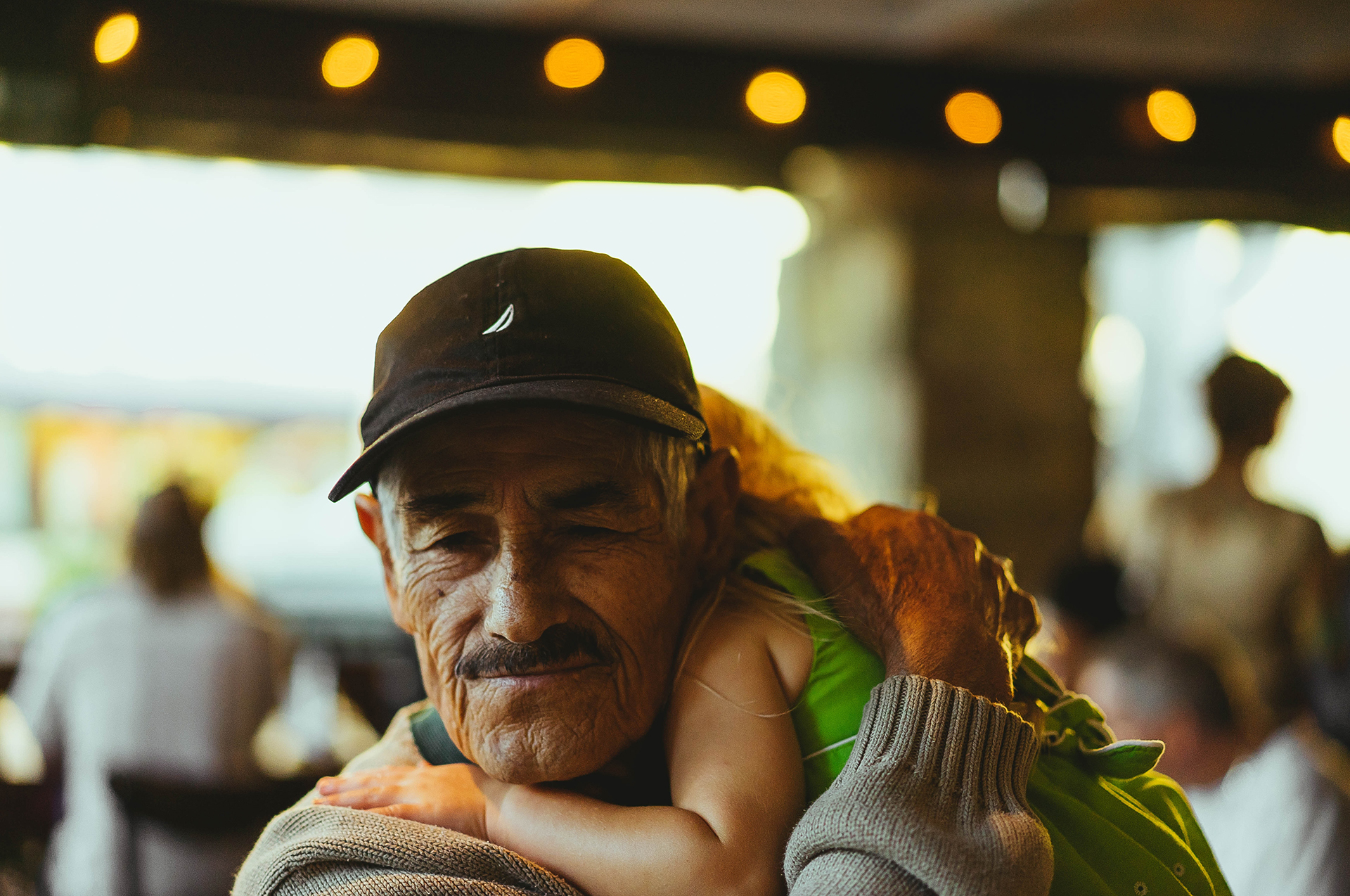 Grandpa hugging granddaughter